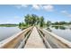 Wooden bridge over calm water at 1020 Golf Course Pkwy, Davenport, FL 33837