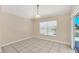 Bright dining room with tile floor and pool view at 1020 Golf Course Pkwy, Davenport, FL 33837