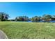 Golf course view with lush green grass and a pond at 1020 Golf Course Pkwy, Davenport, FL 33837