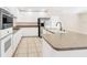 Modern kitchen with stainless steel appliances and island at 1020 Golf Course Pkwy, Davenport, FL 33837