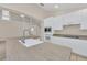Kitchen with white cabinets, stainless steel appliances, and an island at 1020 Golf Course Pkwy, Davenport, FL 33837