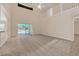 Bright and airy living room with high ceilings and views of the pool at 1020 Golf Course Pkwy, Davenport, FL 33837
