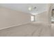 Spacious living room featuring high ceilings and carpet at 1020 Golf Course Pkwy, Davenport, FL 33837