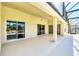 Covered patio with access to the pool and backyard at 1020 Golf Course Pkwy, Davenport, FL 33837
