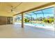 Spacious pool area with covered patio and sliders to interior at 1020 Golf Course Pkwy, Davenport, FL 33837