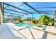 Inviting pool and spa with screened enclosure at 1020 Golf Course Pkwy, Davenport, FL 33837