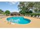 Community pool with surrounding lounge chairs at 1020 Golf Course Pkwy, Davenport, FL 33837