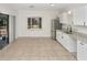 Kitchen with white cabinets, granite countertops, and stainless steel appliances at 1234 Lynwood Ave, Apopka, FL 32703
