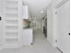 Bright kitchen with white cabinetry, granite counters, and built-in shelving at 1234 Lynwood Ave, Apopka, FL 32703