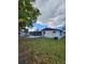 Red and white house with a screened-in porch at 1427 Wilton Ave, Orlando, FL 32805