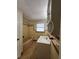 Bathroom with a bathtub, vanity, window, and tile walls at 1427 Wilton Ave, Orlando, FL 32805