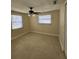 Bedroom with tiled flooring, ceiling fan, windows, and blinds at 1427 Wilton Ave, Orlando, FL 32805