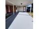 Covered carport area with a red front door and side entrance at 1427 Wilton Ave, Orlando, FL 32805