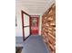 Open red front door of a house with a brick exterior wall at 1427 Wilton Ave, Orlando, FL 32805