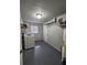 Laundry room with a washing machine, water heater, and storage at 1427 Wilton Ave, Orlando, FL 32805