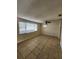 Living room with tile flooring, large window, and ceiling fan at 1427 Wilton Ave, Orlando, FL 32805