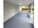 Spacious screened porch with a gray floor and white frame at 1427 Wilton Ave, Orlando, FL 32805