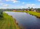 Community canal-front view with lush landscaping at 166 Prima Dr, Kissimmee, FL 34759