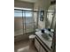 Bathroom with shower/tub combo, white vanity, and tiled floor at 2528 Chatham Cir, Kissimmee, FL 34746