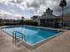 Community pool with a small pool house and plenty of space for lounging at 2528 Chatham Cir, Kissimmee, FL 34746
