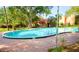 Kidney-shaped community pool with brick deck at 2812 N Powers Dr # 72, Orlando, FL 32818