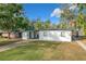 Charming single-story home with white brick exterior and landscaped front yard at 2909 Willow Ave, Lakeland, FL 33803