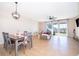 Spacious open-concept living and dining area with wood-look flooring and abundant natural light at 3896 Grassland Dr, Orlando, FL 32824