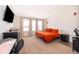 Large main bedroom with plush carpet, a king-size bed, and windows showcasing natural light at 3896 Grassland Dr, Orlando, FL 32824