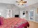 Bright bedroom with king bed, and views of the backyard at 411 Ridge View Dr, Davenport, FL 33837