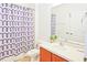 Neat bathroom featuring a shower/tub and single sink vanity at 4577 Alberto Cir, Kissimmee, FL 34746