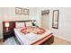 Spacious bedroom with a queen-size bed and large closet at 4577 Alberto Cir, Kissimmee, FL 34746