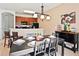 Dining area with a table and chairs adjacent to the kitchen at 4577 Alberto Cir, Kissimmee, FL 34746