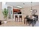 Kitchen with breakfast bar, dark wood cabinets, and black appliances at 4577 Alberto Cir, Kissimmee, FL 34746