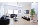 Living room with two sofas, a coffee table, and a large TV at 4577 Alberto Cir, Kissimmee, FL 34746