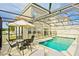 Private screened pool and patio furniture, perfect for relaxation at 4577 Alberto Cir, Kissimmee, FL 34746