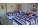 Bedroom with two double beds and Mickey Mouse decor at 5245 W Irlo Bronson Memorial Hwy # 115, Kissimmee, FL 34746