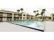 Refreshing swimming pool with surrounding lounge chairs at 5245 W Irlo Bronson Memorial Hwy # 115, Kissimmee, FL 34746