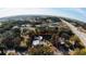 High-angle aerial view showcasing a property with a house, trees, and nearby highway at 721 Langston Ave, Haines City, FL 33844