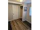 Bedroom with new flooring, closet, and window at 721 Langston Ave, Haines City, FL 33844