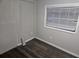 Bedroom with new flooring and a window at 721 Langston Ave, Haines City, FL 33844
