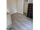 Simple bedroom with wood-look floors and a dresser at 721 Langston Ave, Haines City, FL 33844