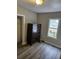 Spacious bedroom with wood-look floors and a dresser at 721 Langston Ave, Haines City, FL 33844