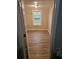 Simple bedroom with wood-look floors and a window at 721 Langston Ave, Haines City, FL 33844