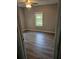 Bedroom with wood-look floors and ceiling fan at 721 Langston Ave, Haines City, FL 33844