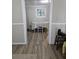 Bright dining area with table and chairs, wood-look floors at 721 Langston Ave, Haines City, FL 33844