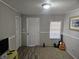 Living room with wood-look floors, window, and entryway at 721 Langston Ave, Haines City, FL 33844