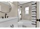 Modern bathroom with tiled shower, white vanity, and contemporary fixtures at 7715 Perugia Ave, Orlando, FL 32819