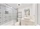 Stylish bathroom with modern vanity, patterned tile, and updated fixtures at 1006 Plantation Dr # F12, Kissimmee, FL 34741