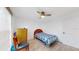 Cozy bedroom with ceiling fan, wood-look floors, and neutral walls at 1006 Plantation Dr # F12, Kissimmee, FL 34741