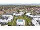 Aerial view of a community with a pool, parking, and green spaces at 1006 Plantation Dr # F12, Kissimmee, FL 34741